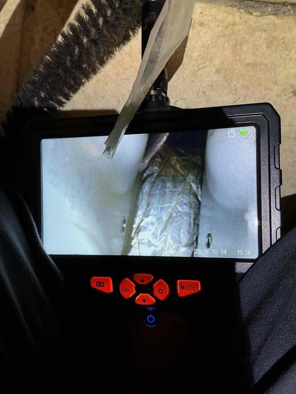 Performed a seasonal tune-up on a Lennox gas furnace located in a utility closet, including inspection of the furnace cabinet, flue venting, condensate/drain line, and plenum-mounted humidifier. Used a borescope inspection camera to visually examine the interior of the flexible duct and connected ductwork for obstructions or damage, and verified overall system condition for safe, efficient operation.
