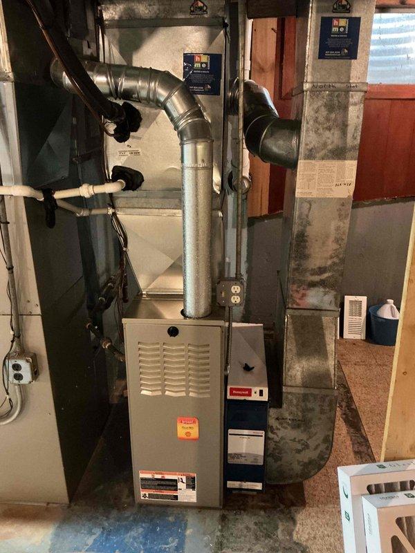 Performed a comprehensive clean and check on two gas furnace systems, including inspection of the burners, heat exchangers, flue venting, condensate drainage, and electrical connections, along with verification of proper operation through a full heating cycle. Serviced both humidifiers and inspected the water heater, and installed two new 16x25x4 media filters. No deficiencies were identified, and both systems were left operating normally.