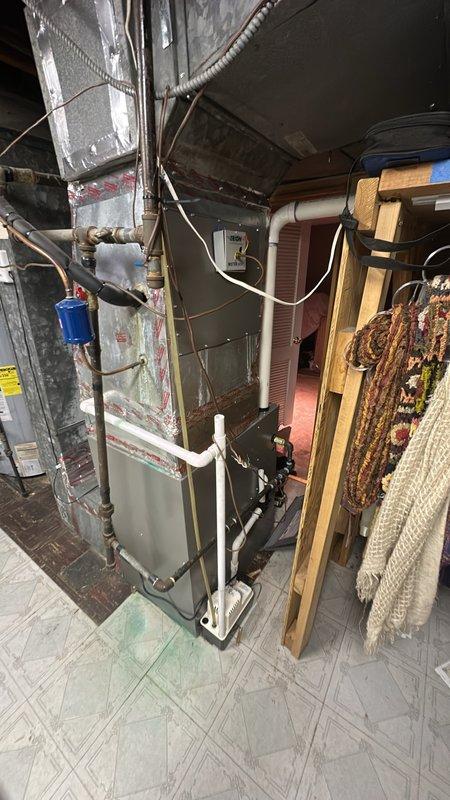 Diagnosed and serviced malfunctioning humidifier system connected to customer's aging furnace unit. Inspected the TRIOM "MISTER MIST" control box and associated PVC drainage/supply lines for proper operation. Performed necessary adjustments to restore proper humidity control functionality.