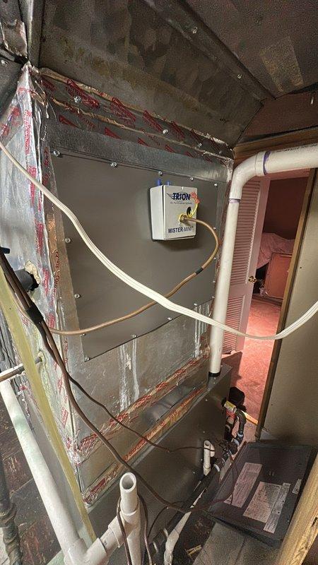 Diagnosed and serviced malfunctioning humidifier system connected to customer's aging furnace unit. Inspected the TRIOM "MISTER MIST" control box and associated PVC drainage/supply lines for proper operation. Performed necessary adjustments to restore proper humidity control functionality.