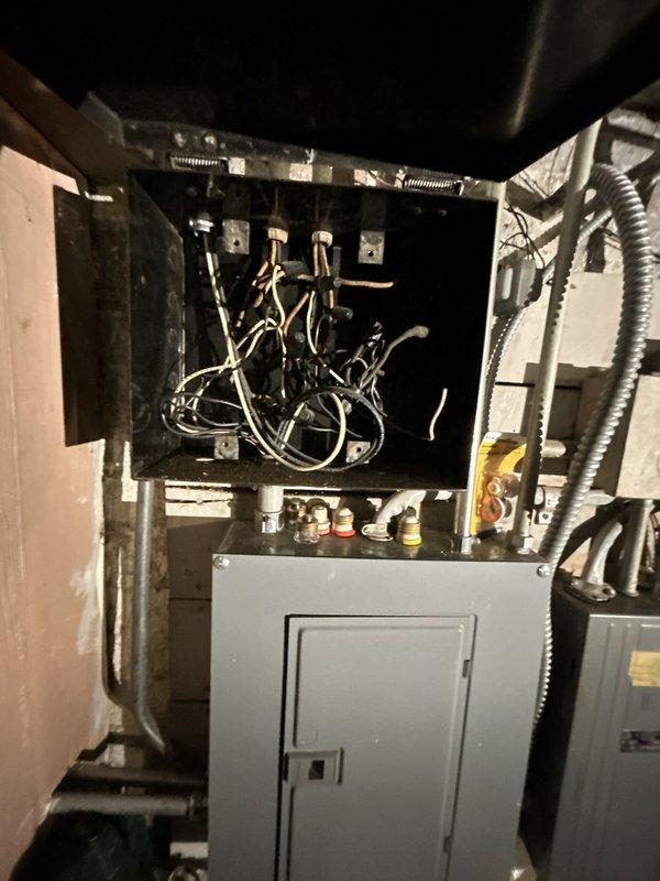 Performed initial assessment for customer's requested electrical upgrades. Inspected main circuit breaker panel and junction box with exposed wiring, noting aged components and disorganized wiring configuration. Documented existing electrical infrastructure with photos for comprehensive quote preparation.