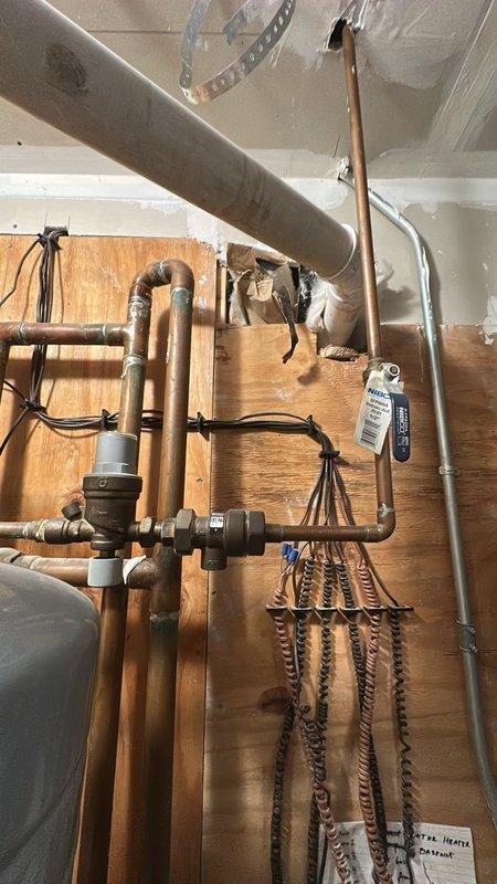 Responded to customer report of possible pressure valve leak on 2023-installed furnace. Upon inspection of the residential hydronic heating system, examined copper piping network, manifolds with PEX connections, and zone control valves. No active leaks were found in the plumbing assembly or pressure relief valve. System pressure tested and verified to be operating within normal parameters.