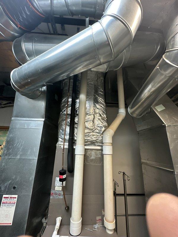 Conducted on-site assessment for duct cleaning service requested in single classroom area. Inspection revealed extensive HVAC system with professionally installed galvanized steel ductwork, including insulated sections and associated condensate drainage. Additional examination of air handling equipment showed accessible internal components requiring maintenance attention, indicating potential for more comprehensive service than initially requested.