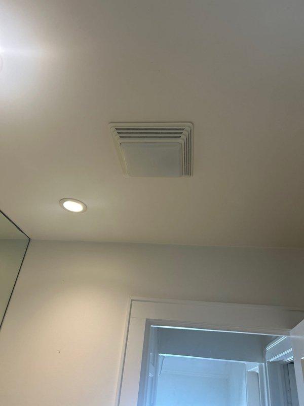 Conducted inspection of bathroom electrical fixtures to verify previous quote details. Documented existing ventilation fan, recessed lighting, and standard electrical outlet placement to ensure accurate assessment. Completed site evaluation for client to receive updated service proposal.