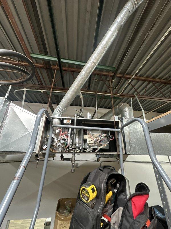 Responded to service call for dual-unit HVAC system where one unit was reported as non-operational. Performed diagnostic inspection on commercial rooftop gas furnace unit, accessing internal components including burner assembly, gas lines, and electrical wiring. Documented equipment condition and configuration for customer with active membership account.