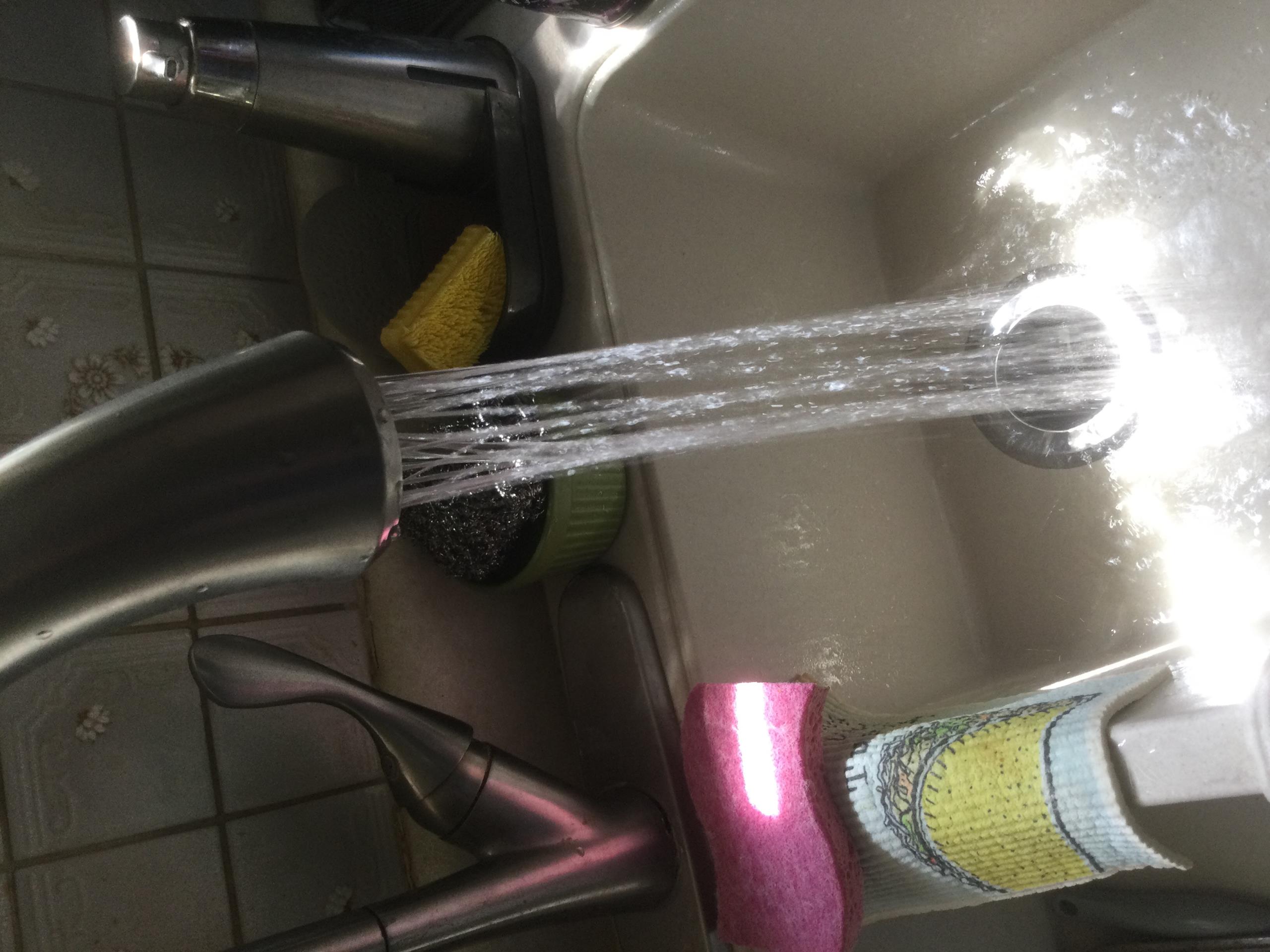 Cleaned kitchen sink faucet Aerator and put back in service warranty call no charge 