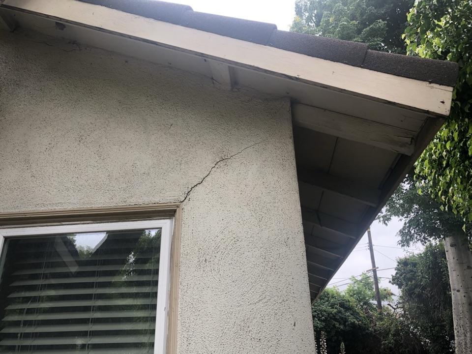 Settlement crack in stucco.