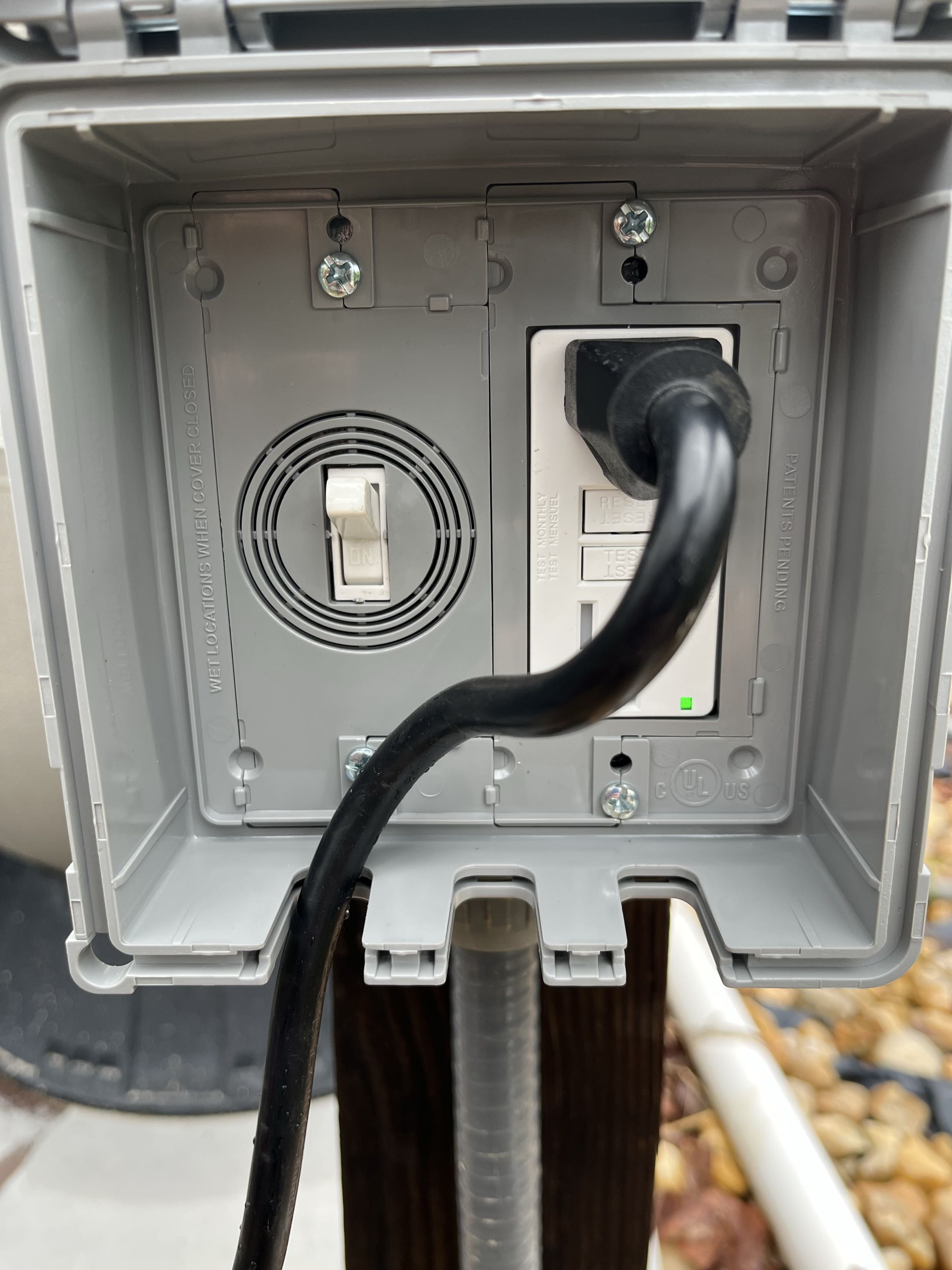 Removed a pool timer and installed new outdoor box and cover with new weather rated GFCI and switch to control pool equipment