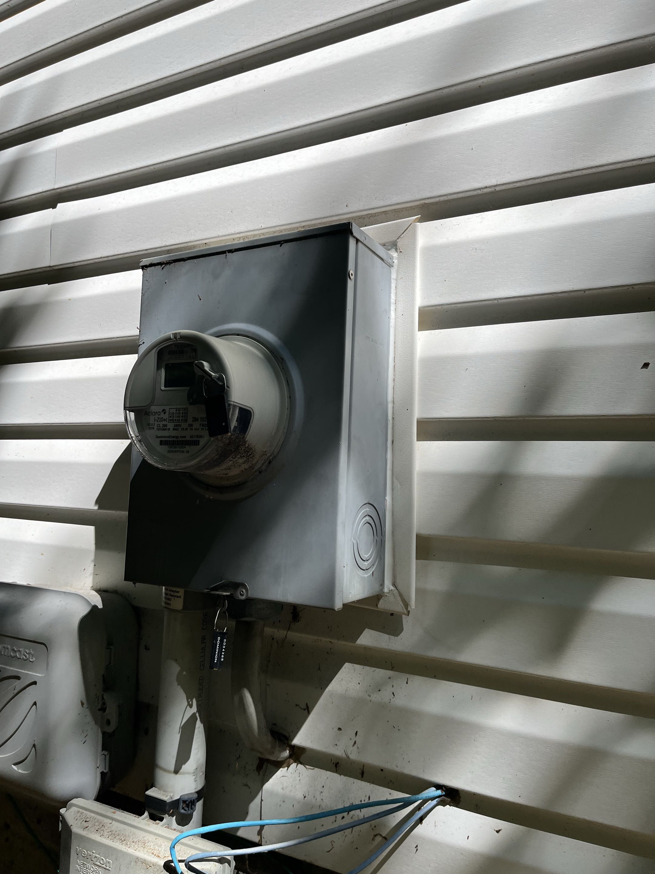 Reinstalled electric meter that was falling off house 