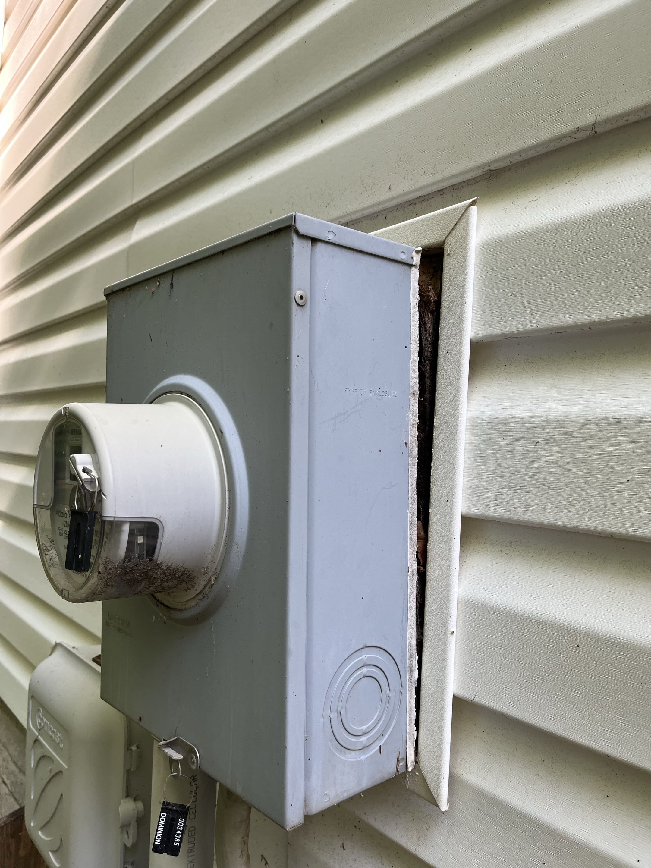 Reinstalled electric meter that was falling off house 