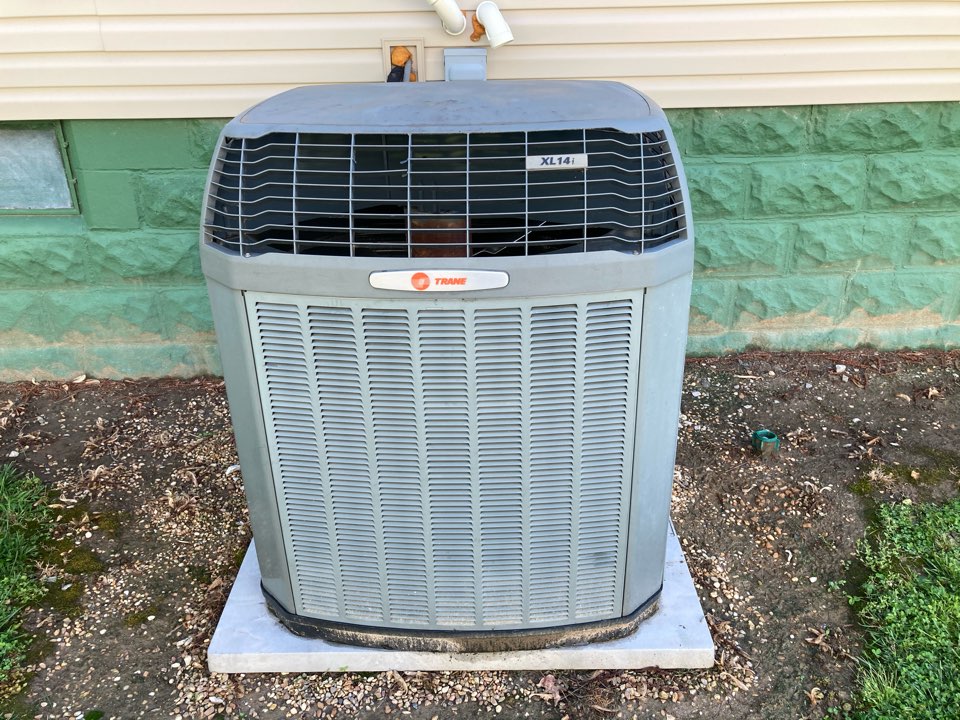 Performing maintenance on a Trane XL heat pump Ziegler.