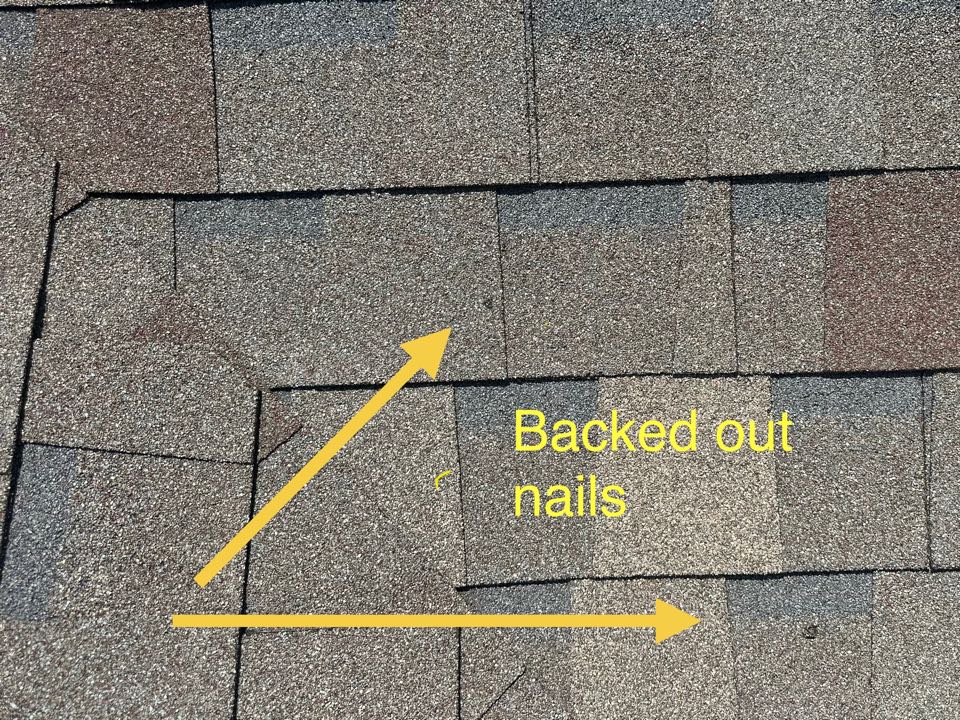 Why is this roof leaking? The nails are backing out and poking holes through the shingle above. The other reason it’s leaking is the chimney crown needs repaired.