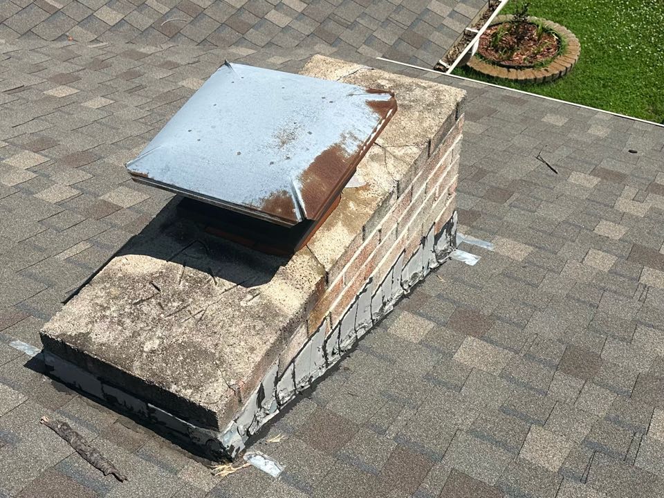 Why is this roof leaking? The nails are backing out and poking holes through the shingle above. The other reason it’s leaking is the chimney crown needs repaired.