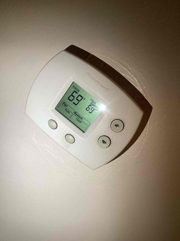 Performed scheduled maintenance on cooling system at client's residence. Inspected thermostat (currently set to Heat mode at 69°) and confirmed proper operation. Examined A.O. Smith water heater with Energy Saver feature, noting all connections were secure and functioning normally.