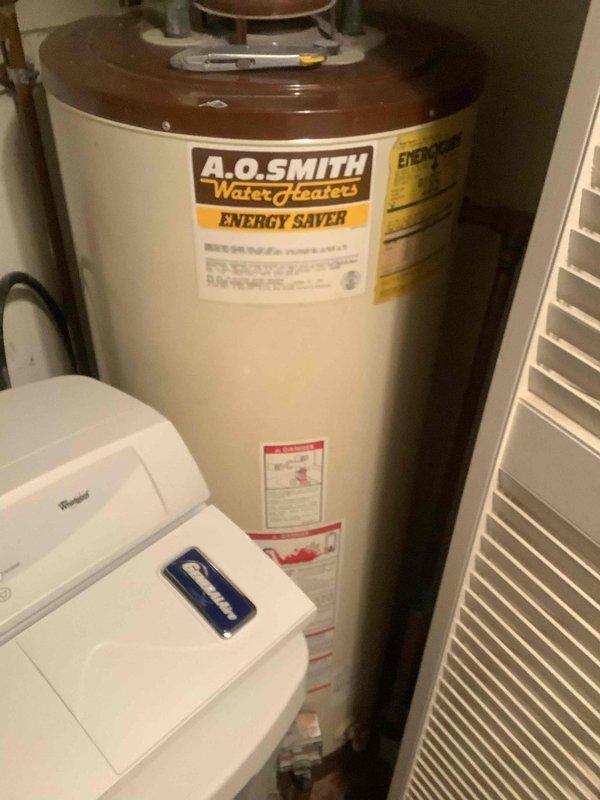 Performed scheduled maintenance on cooling system at client's residence. Inspected thermostat (currently set to Heat mode at 69°) and confirmed proper operation. Examined A.O. Smith water heater with Energy Saver feature, noting all connections were secure and functioning normally.
