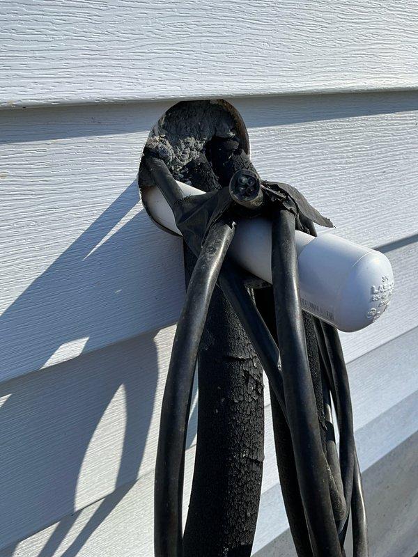 Inspected incomplete mini-split installation initiated by previous homeowners at new client's residence. Observed partial exterior installation with electrical components and line sets penetrating through exterior siding, showing evidence of improper weatherproofing. Evaluated current setup to provide estimate for proper completion of the mini-split system installation.