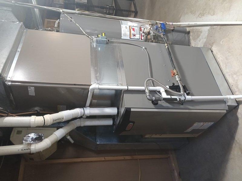 Successfully installed new Lennox gas furnace in customer's utility room. Verified proper installation with temperature testing using Klein Tools digital thermometer, confirming system is operating at 80.9°F. All ductwork, drain lines, and electrical connections were properly installed per manufacturer specifications.