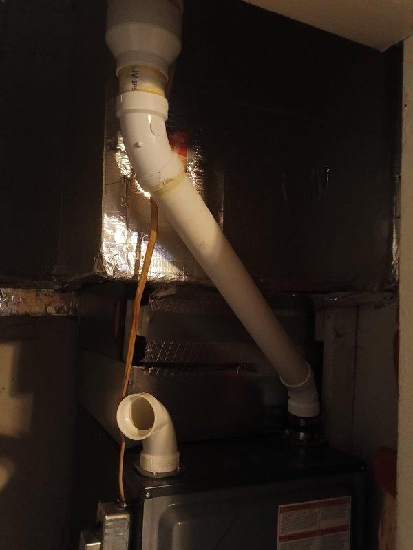 Diagnosed faulty internal Daikin drain trap in furnace requiring replacement under warranty. Unable to complete replacement due to incorrect part expectations (anticipated external p-trap replacement). Cut and added coupling to flu pipe section where previous improper installation had resulted in condensate leakage around silver tape.