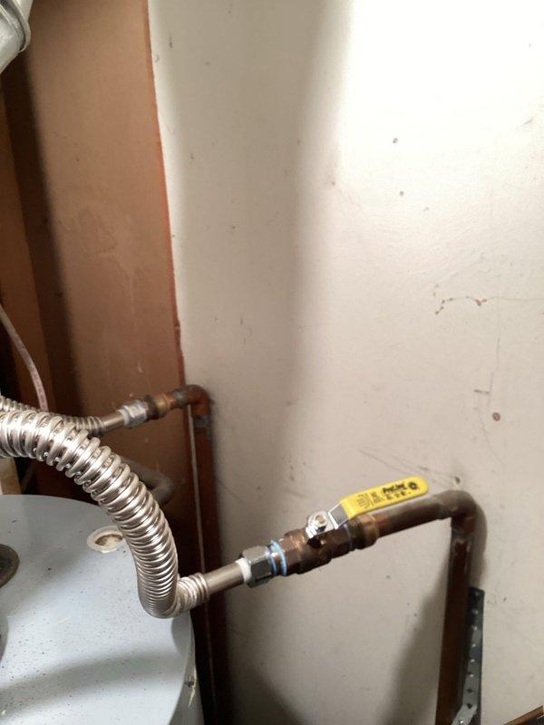 Conducted annual plumbing inspection service on water heater and associated plumbing components. Inspected State brand water heater for proper operation, checking connections, pressure relief valve, and drain valve functionality. Examined copper pipe connections and flexible metal connectors for integrity, with all systems found to be in satisfactory working condition.