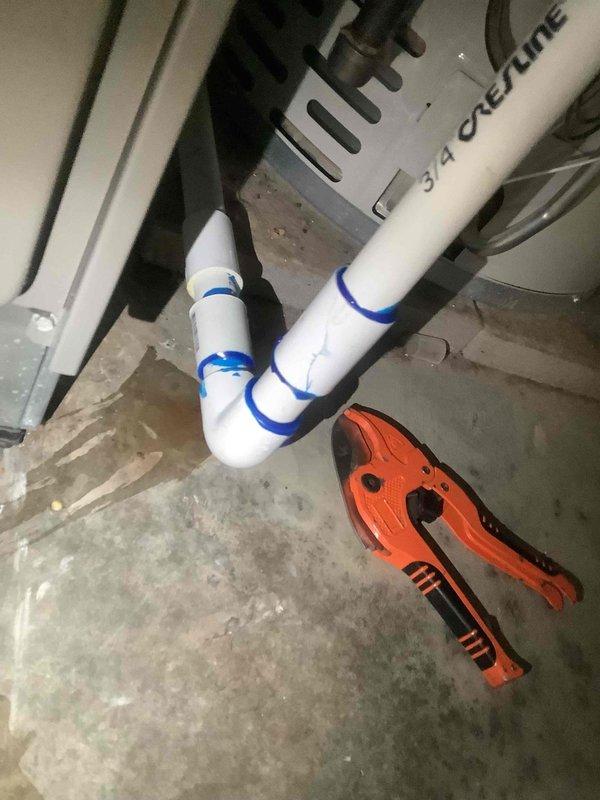 Responded to warranty call for leaking pipe and E155AE1 error code. Identified leaking condensate drain line and replaced damaged PVC section using proper adhesive at joints. Inspected electrical connections in unit, found loose wiring causing error code, and secured all connections. System now operating properly with no leaks or error codes.