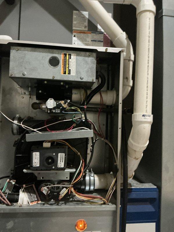 Performed routine furnace maintenance for membership holder Nancy Reynolds. Inspected interior components of heating system including electrical connections, wiring harnesses, and PVC ventilation/drainage pipes. Checked Honeywell Home digital thermostat functionality; confirmed proper operation with temperature settings at 71°F actual/74°F target.