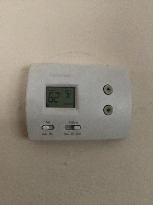 Diagnosed and serviced a Goodman furnace (10+ years old) with no heat issue. Upon inspection, found thermostat was correctly set to heat mode at 62°F but system was unresponsive. Identified failed ignition control module and worn flame sensor as primary causes. Replaced both components, cleaned system connections, and performed complete system test. Unit now operating properly with consistent flame and normal heating cycle.