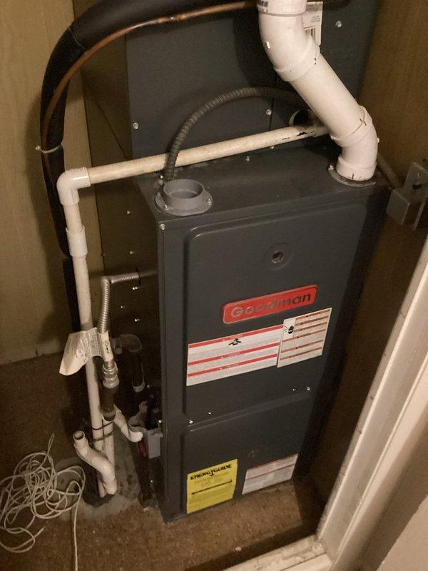 Diagnosed and serviced a Goodman furnace (10+ years old) with no heat issue. Upon inspection, found thermostat was correctly set to heat mode at 62°F but system was unresponsive. Identified failed ignition control module and worn flame sensor as primary causes. Replaced both components, cleaned system connections, and performed complete system test. Unit now operating properly with consistent flame and normal heating cycle.