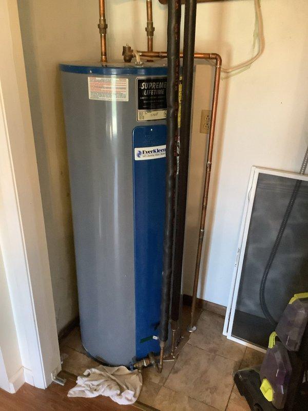 Successfully installed a new Supreme Lifetime electric water heater with EverKleen system in the utility closet. Connected copper supply lines, installed proper electrical connections, and ensured all fittings were secure with no leaks present upon final inspection.