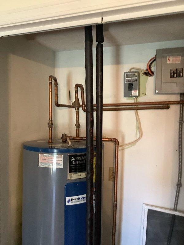 Successfully installed a new Supreme Lifetime electric water heater with EverKleen system in the utility closet. Connected copper supply lines, installed proper electrical connections, and ensured all fittings were secure with no leaks present upon final inspection.