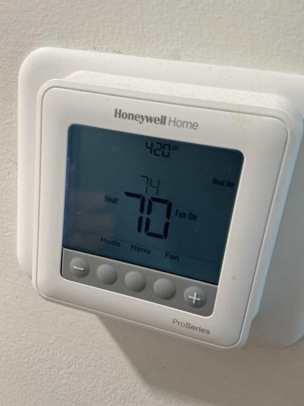 Performed scheduled basic monthly maintenance on the CCHP-Heating system. Inspected A.O. Smith ProMax water heater for proper operation and verified Honeywell Home ProSeries thermostat functionality, confirming heat mode operation with current temperature at 74°F against setpoint of 70°F. Filter replacement not included in this service.