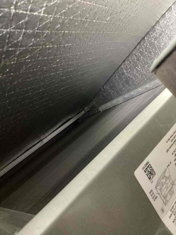 Performed scheduled furnace maintenance on residential heating system. Inspected electrical connections at terminal block and examined ductwork for proper installation. All components appear to be in working order with properly secured wiring connections.