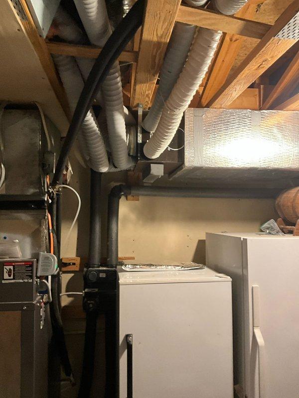 Inspected 1991-built residence with reported occupant health concerns and no prior duct cleaning history. Examination revealed significant dust accumulation around smoke detector and aging ventilation system. Performed comprehensive assessment of HVAC system, focusing on flexible ductwork in utility area. Recommended complete professional duct cleaning to address potential indoor air quality issues and improve system efficiency.