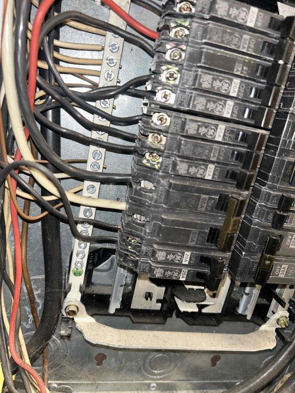 Inspected electrical panel to diagnose no heat issue in aging HVAC system. Found and inspected multiple circuit breakers including 20A and 60A units, verifying proper electrical supply to heating equipment. Confirmed all connections were secure with no visible damage to wiring.