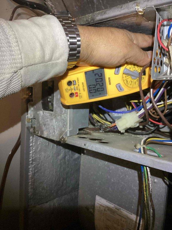 Responded to emergency no-heat call for furnace system. Performed diagnostic electrical testing with multimeter on control panel, measuring 230V/60Hz at the main power supply. Identified and replaced blown fuse in electrical panel that was preventing system operation, restoring heat functionality.