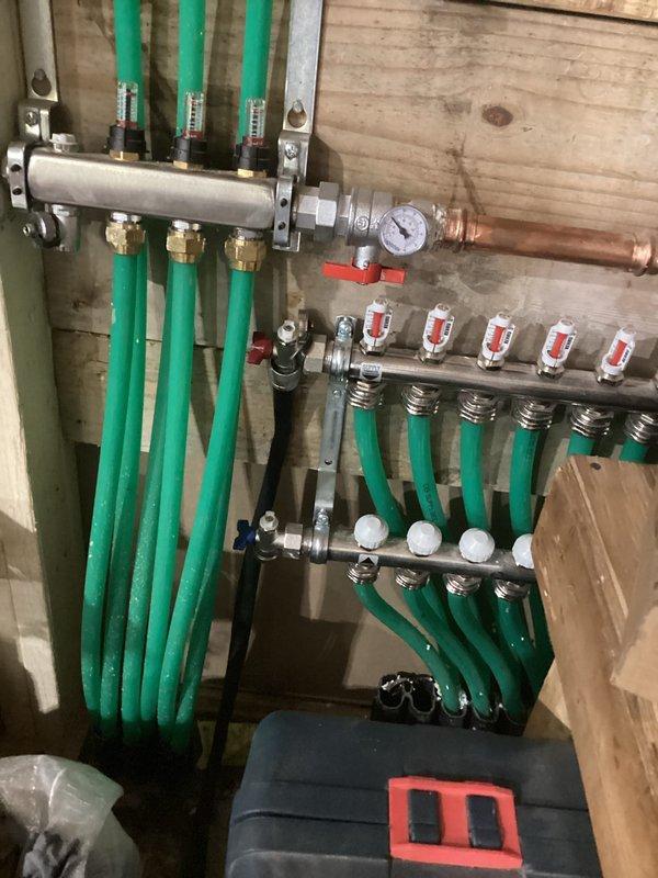 Performed warranty service on heating system with uneven heat distribution across floor. Inspected PEX manifold system and copper pipe network. Identified and corrected issues with circulation through manifold valves, ensuring proper flow balance to resolve the partial heating problem.