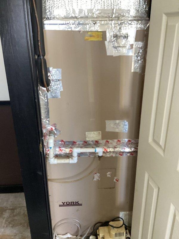 Responded to service call for non-operational York HVAC unit. Performed diagnostic inspection of the system components and connections in utility closet. Verified thermostat functionality, which displayed proper temperature reading (76°F) and had operational controls for fan and system settings.