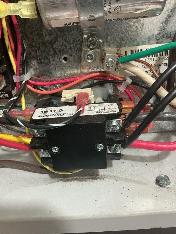 Performed scheduled maintenance on customer's geothermal heating system. Inspected electrical components including compressor disconnect box and relay/transformer assembly. Verified all connections were secure with proper wire terminations and confirmed system operation.