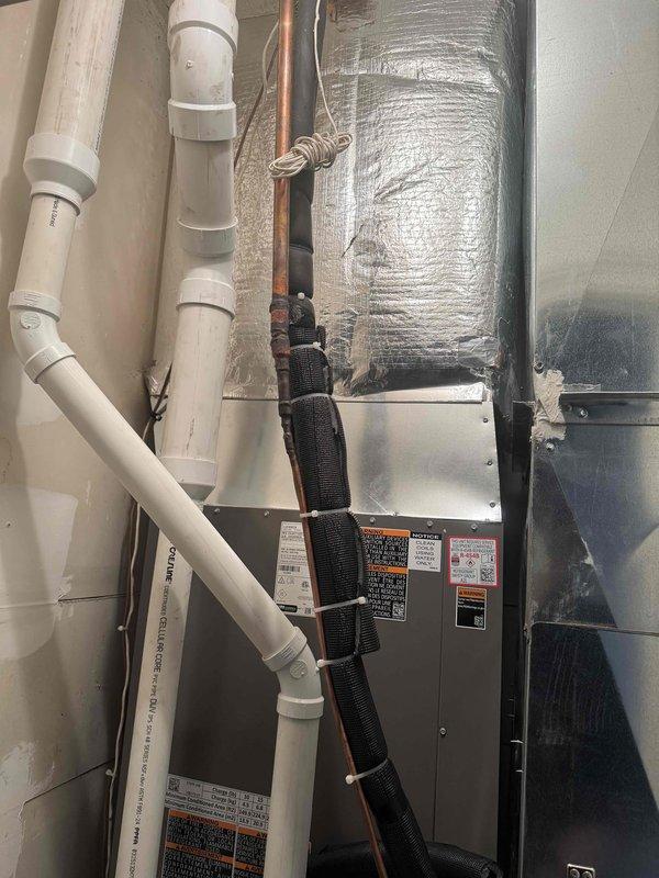 Installed Lennox furnace system in garage with complete plenum and ducting configuration. Connected all necessary refrigerant lines with proper insulation and installed PVC condensate drainage system with multiple elbow joints. Completed system startup and verified proper operation of all components.