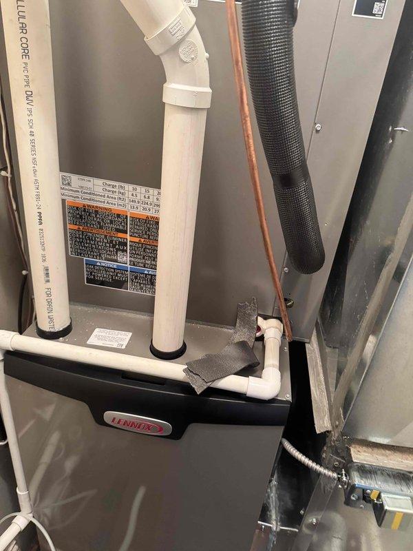 Installed Lennox furnace system in garage with complete plenum and ducting configuration. Connected all necessary refrigerant lines with proper insulation and installed PVC condensate drainage system with multiple elbow joints. Completed system startup and verified proper operation of all components.