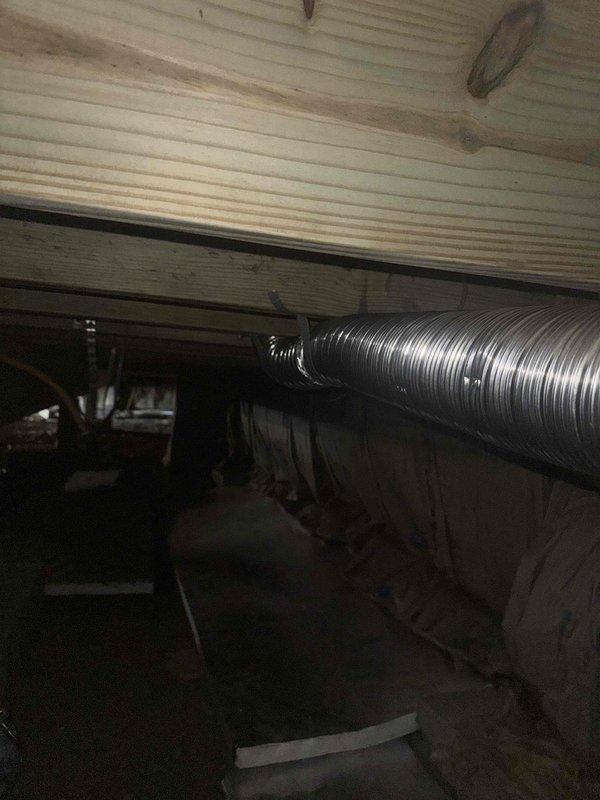 Completed rough-in electrical work for new construction, installing three recessed lighting fixtures in garage near entry. Inspected plumbing rough-in showing red, white, and blue PEX pipes in utility room corner. Evaluated HVAC ductwork in crawlspace and assessed requirements for dryer vent installation.