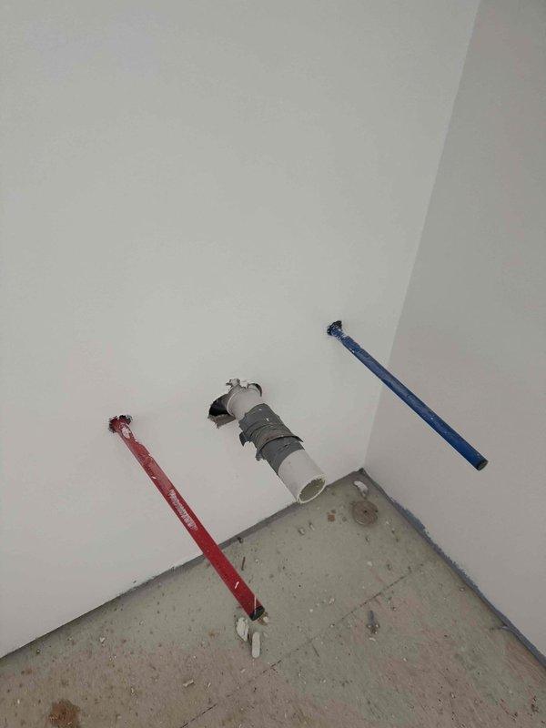 Completed rough-in electrical work for new construction, installing three recessed lighting fixtures in garage near entry. Inspected plumbing rough-in showing red, white, and blue PEX pipes in utility room corner. Evaluated HVAC ductwork in crawlspace and assessed requirements for dryer vent installation.