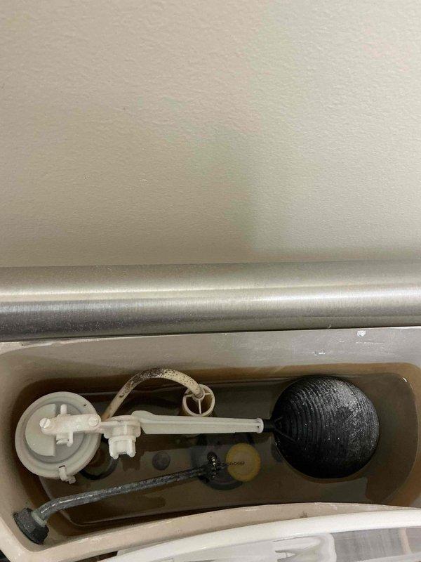 Responded to service call for toilet flushing issue. Inspected American Standard toilet and flush mechanism. Identified malfunctioning components in tank including float assembly. Serviced flush valve system and restored proper toilet function.