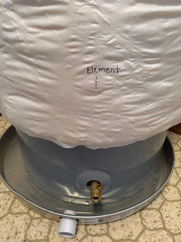 Successfully installed a new tanked water heater system, connecting PEX tubing to copper supply lines with proper compression fittings. Applied insulation blanket to top of unit to improve energy efficiency and reduce heat loss. All connections were secured and system was verified operational with proper drainage pan in place.