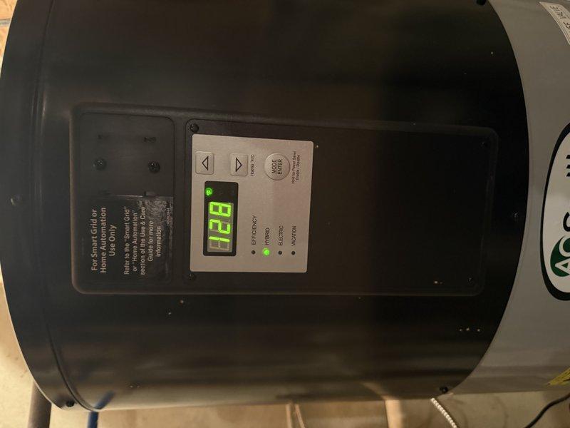 Diagnosed AO Smith hybrid water heater with non-functioning power display. Performed warranty-covered diagnostic inspection of temperature sensor, heating elements, and heat pump components as requested by manufacturer.