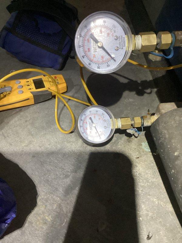 Performed standard clean and check maintenance on heating system. Installed manifold gauges to test pressure readings and used digital multimeter to verify proper system operation. Customer's stepfather was present during service completion.