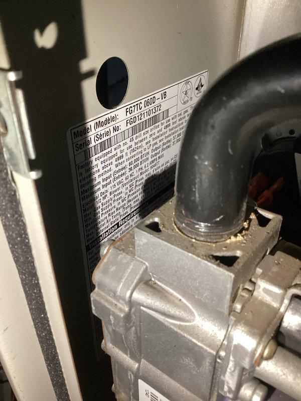 Performed diagnostic service on Goodman FG71C 060D-VB furnace (S/N: FGD12161372) exhibiting ignition failure. Removed access panel to inspect control board and electrical components, finding loose wire connections at the flame sensor circuit. Reconnected and secured all wiring harnesses, cleaned flame sensor, and verified proper ignition sequence through multiple test cycles. Unit now operating within manufacturer specifications with stable flame detection.