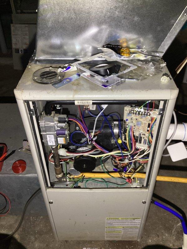 Performed diagnostic service on Goodman FG71C 060D-VB furnace (S/N: FGD12161372) exhibiting ignition failure. Removed access panel to inspect control board and electrical components, finding loose wire connections at the flame sensor circuit. Reconnected and secured all wiring harnesses, cleaned flame sensor, and verified proper ignition sequence through multiple test cycles. Unit now operating within manufacturer specifications with stable flame detection.