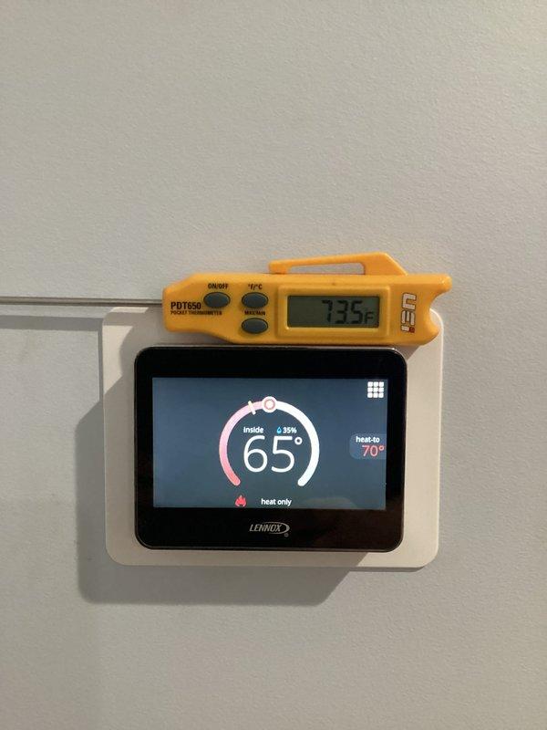 Responded to customer call regarding insufficient heating. Diagnosed error code 270 in both basement and upper furnace units. System was blowing minimal hot air. Performed system reset and verified proper operation using digital thermometer, confirming accurate temperature readings between thermostat display and actual room temperature.