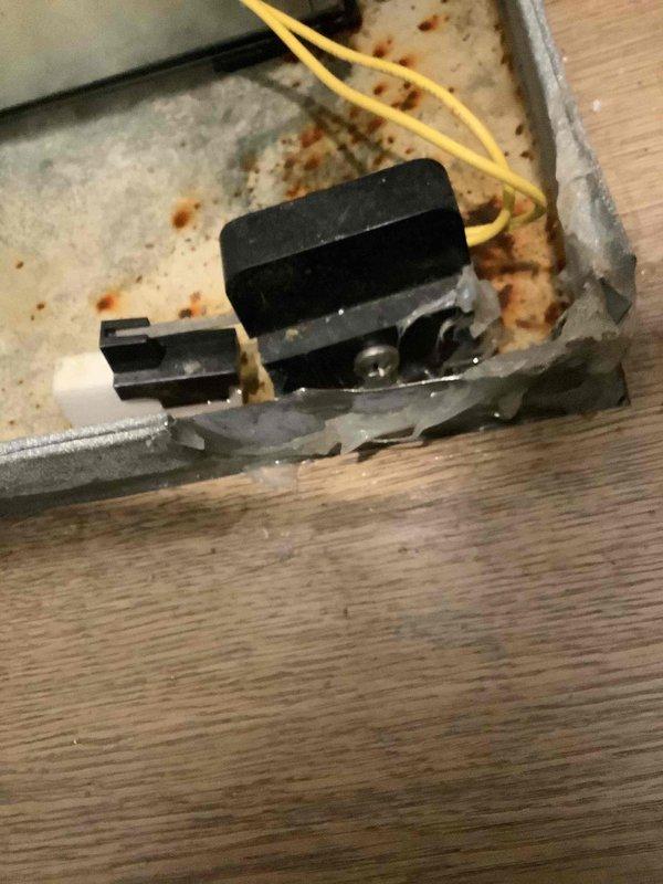 Inspected two leaking furnaces and identified significant corrosion on the drain pan of the upstairs unit. Documented extensive rust damage on metal condensate tray and surrounding components. The upstairs drain pan appears to be improperly positioned, contributing to the leakage issue.