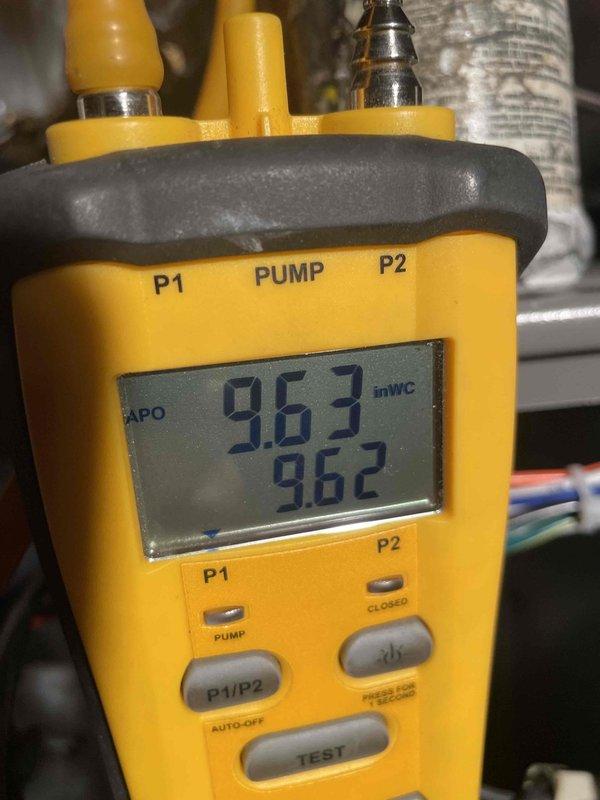 Diagnosed HVAC system requiring replacement of gas valve and drain trap. Inspected and photographed existing P-trap assembly with transparent section and measured gas pressure readings of 9.63/9.62 inWC. Will return with necessary replacement components to complete repair.